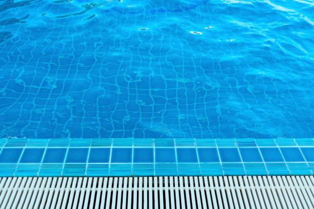 istock Overflow grating of swimming water pool. 1060652692
