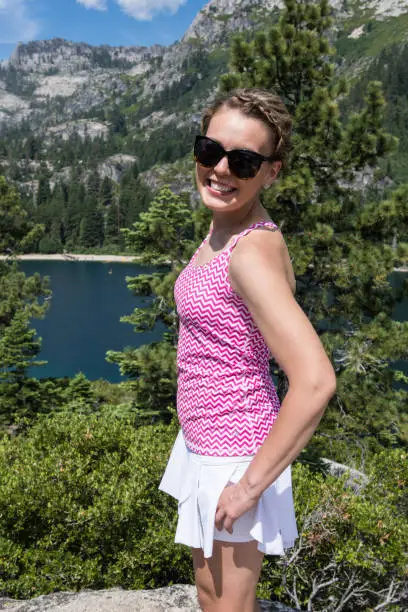 Young woman poses portrait view Fanettte Island in Lake Tahoe California.