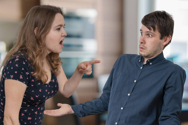 istock Jealousy hysterical wife is shouting and blaming her husband. 1060662862