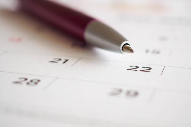 istock Calendar page with pen point at 22nd date 1060666850
