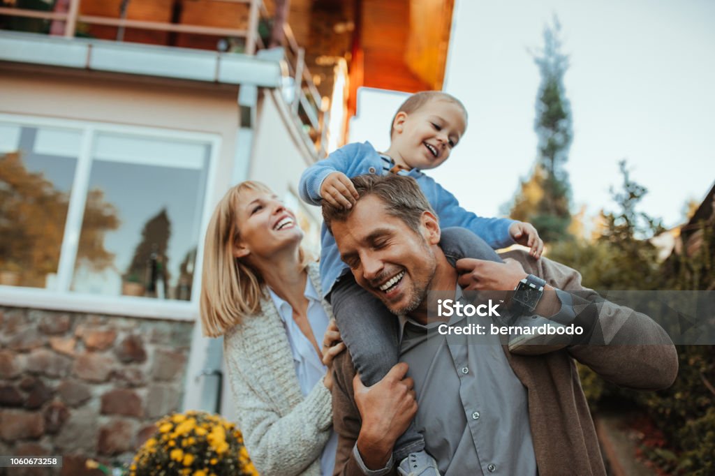 Safe, secure and happy Family is having fun outdoors Family Stock Photo