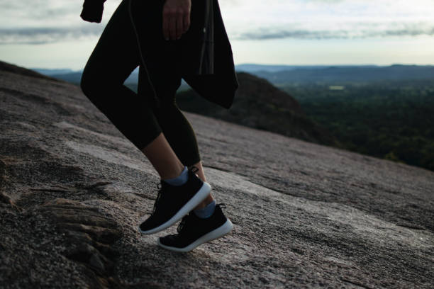 istock Woman Walking Up A Mountain 1060675644