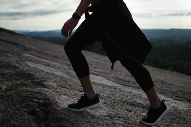 istock Woman Walking Up A Mountain 1060675652