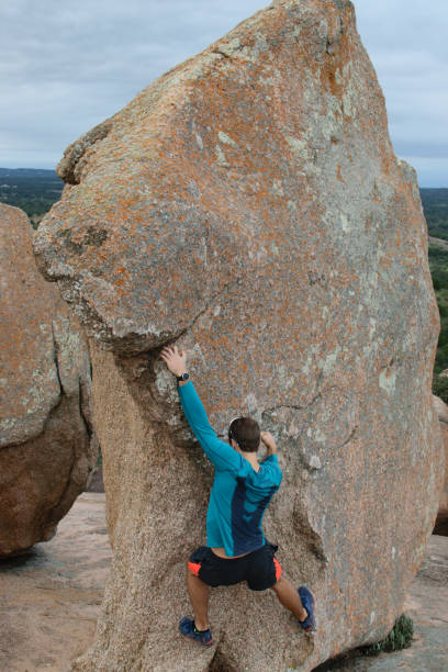 istock Male Rock Climbing Outdoors On A mountain 1060675732