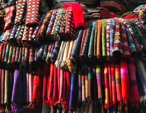 Traditional silk clothes and colorfuls in ancient Koza Han (Silk large commercial building) established on silk road.