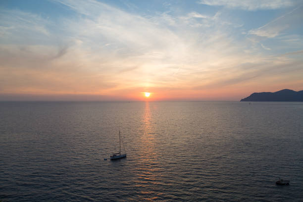 istock Sailing at sunset in Manarola 1060690476
