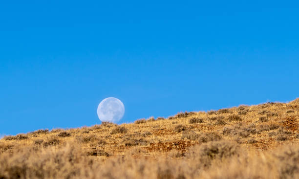 istock Full moon rising over the Nevada Desert. 1060709578
