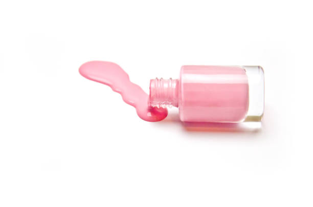 istock pink nail Polish spilled on white background 1060712286