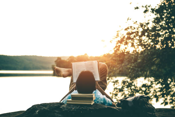 istock Men read books in quiet nature, concept read a books. 1060725532