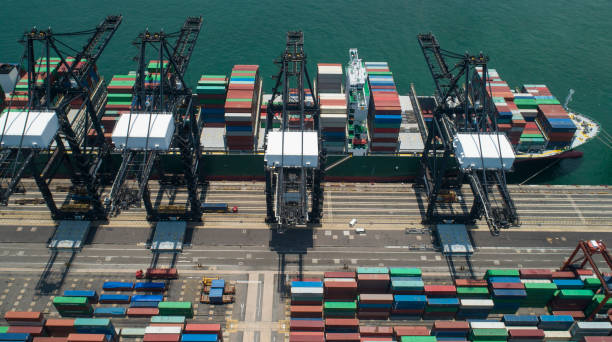 istock Loading cargo container vessel in the container terminal of Hong Kong 1060727920