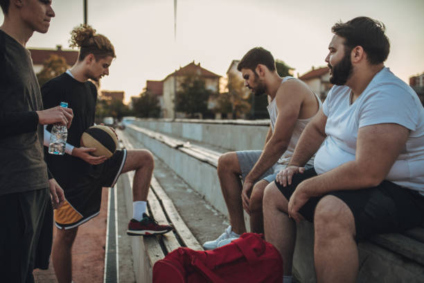 istock Basketball friends sitting together 1060732552
