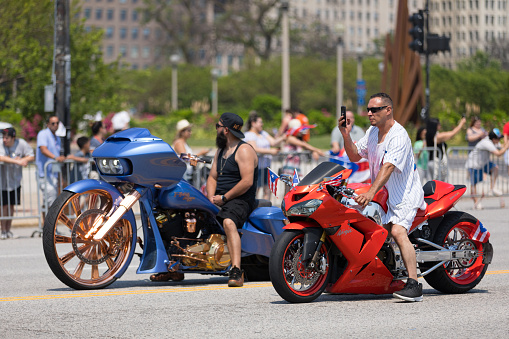 Chicago, Illinois, USA - June 16, 2018: The Puerto Rican Day Parade, Puerto rican bikers riding custom build motorcycles during the parade