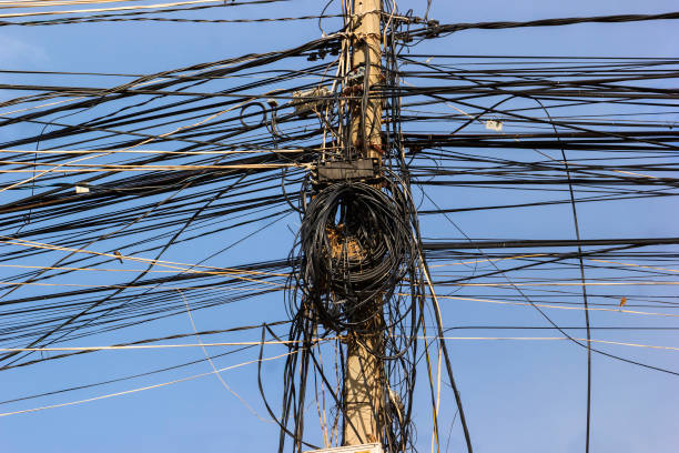 istock Bird nest in Messy electricity post with cable in Cambodia 1060734700