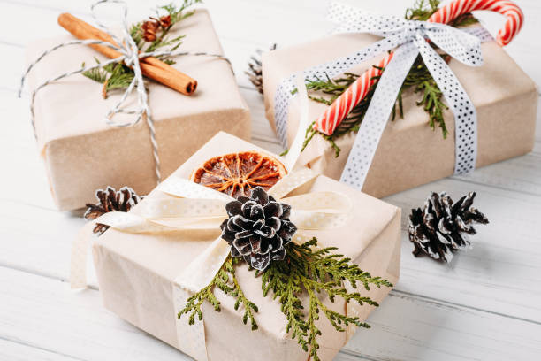 istock christmas gift boxes and decorations on a white wooden background 1060740860