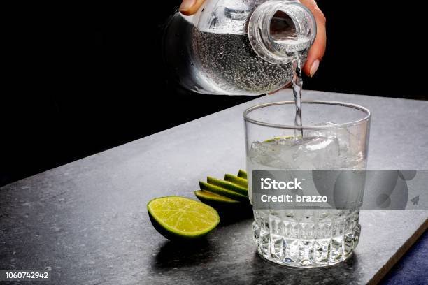 Water Being Poured Into A Glass Stock Photo - Download Image Now - Water, Soda, Mineral