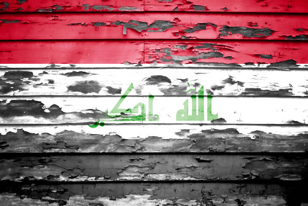 istock Concept Iraq flag on cracked and paint peeling off background 1060743102