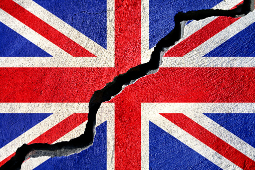 Concept american and United Kingdom on cracked background