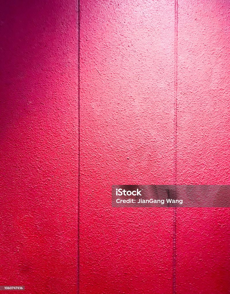 Red painted wall texture With vertical lines Night Stock Photo