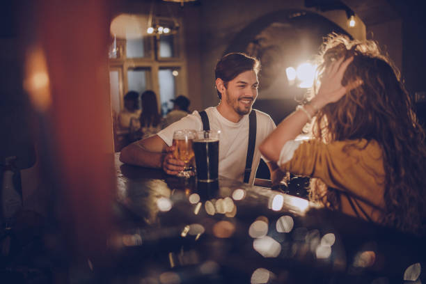 istock Couple drinking beer in pub 1060750416