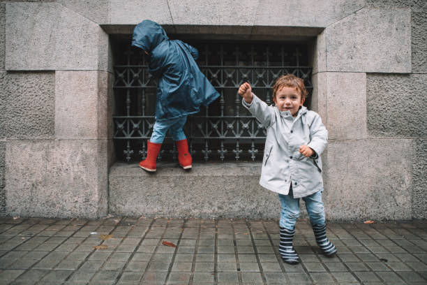 Little boys in rain
