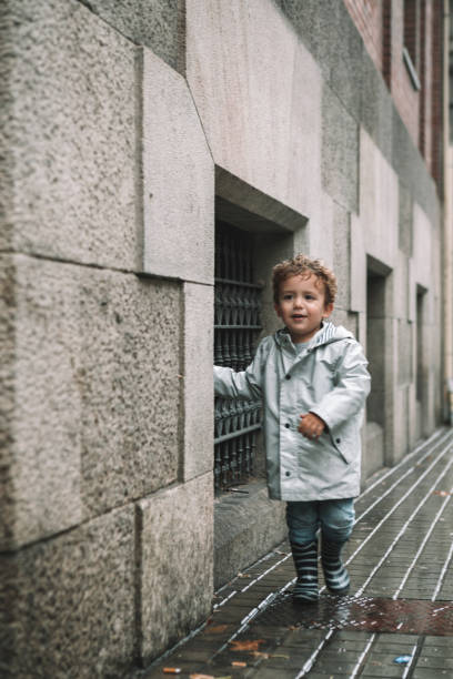 istock Little boy in rain 1060752590