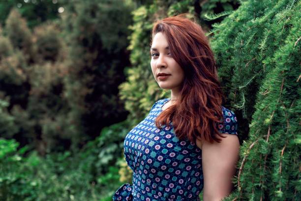 Plump girl on a botanical spring walk