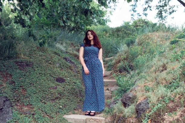 Plump girl on a botanical spring walk
