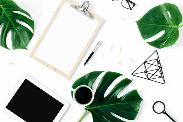 istock Modern office table desk feminine workspace tablet accessories monstera leaves flat lay top view 1060757212