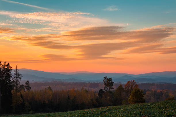 istock Nice sunset sky with hill and trees, Czech republic 1060759024