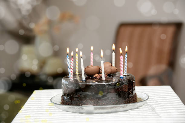 istock birthday cake with candles on table 1060759300