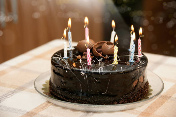 istock birthday cake with candles on table 1060759452