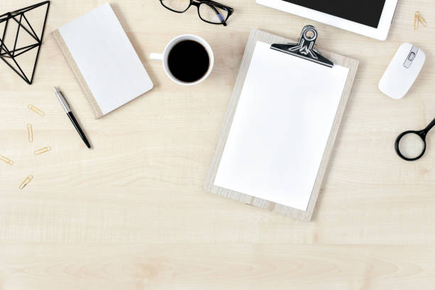 Modern feminine desk workspace clipboard accessories flat lay top view