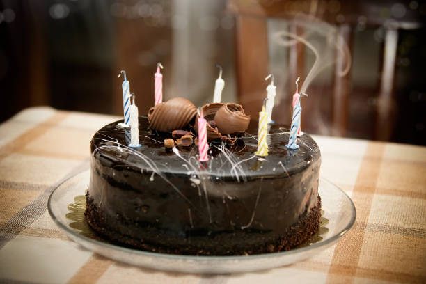 istock birthday cake with candles on table 1060761244