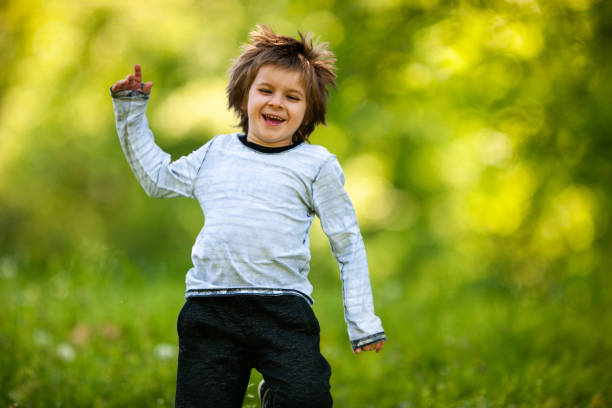 istock Playful little boy having fun while running in nature. 1060764820