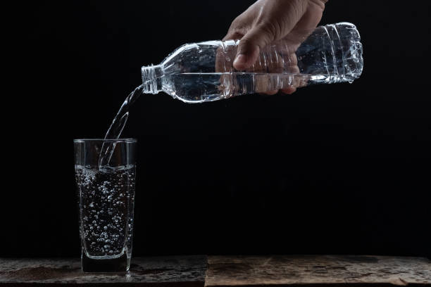 istock filling water to the glass 1060767728