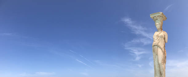 istock Greek caryatid columns at skies panorama 1060769200