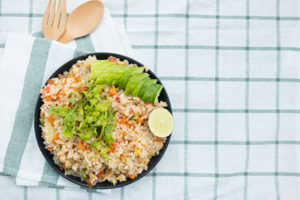 istock Close-up fried rice with pork, served with cucumber and lemon 1060772014