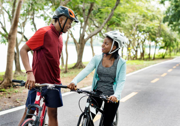 istock Cyclist couple talking together on bikes 1060774930