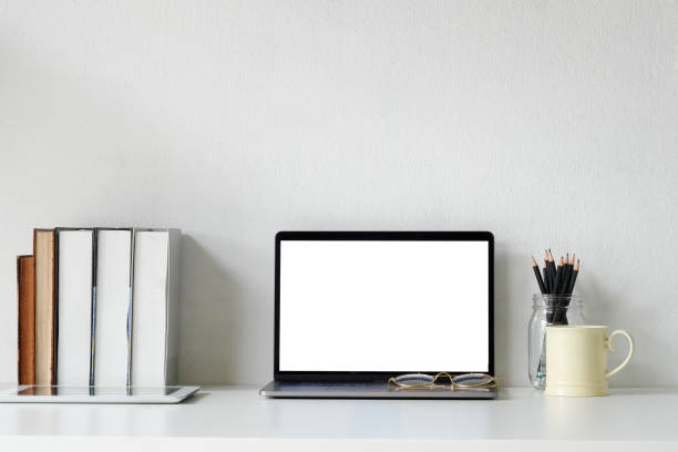 istock Office workspace mockup laptop, books, pencil and coffee mug on office desk. 1060779250