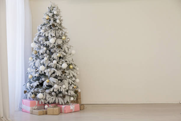 istock Christmas tree with presents, Garland lights new year 1060779438