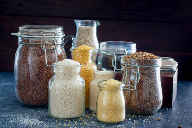 istock Various cereals in glass jars on a table, horizontal 1060779622