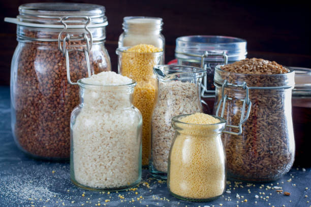 istock Various cereals in glass jars on a table, horizontal 1060779624