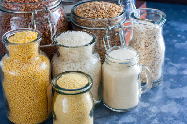 istock Various cereals in glass jars on a table, horizontal 1060779656