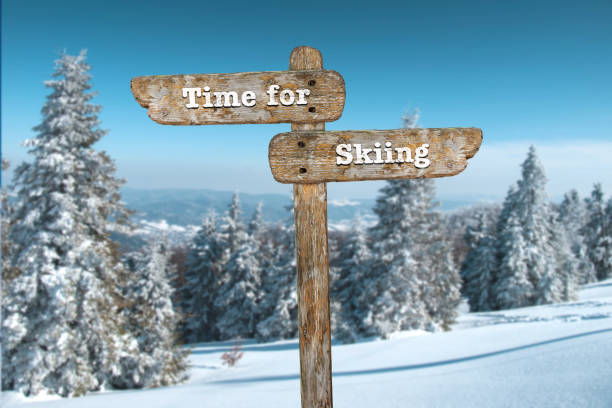 istock Time for skiing. Information sign and blurred background. 1060784730