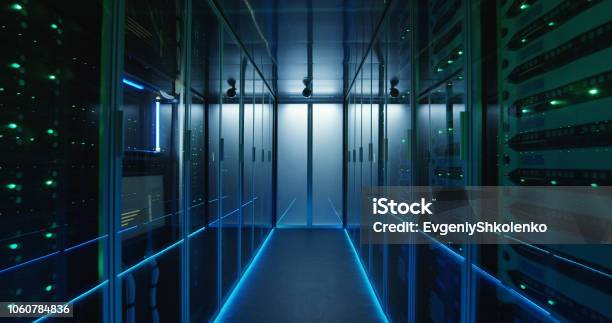 Long Hallway Full Server Racks In A Modern Data Center Stock Photo - Download Image Now