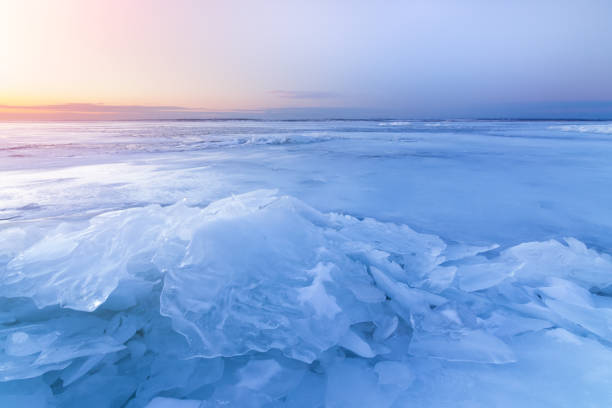 istock dawn at the frozen lake shore 1060785198