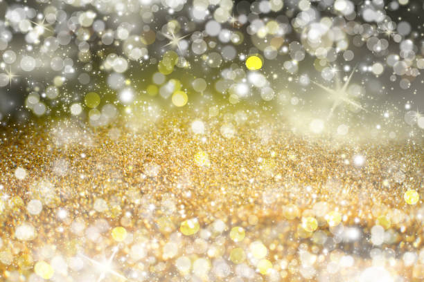 istock Yellow Sparkling Lights Festive background with texture. Abstract Christmas twinkled bright bokeh defocused and Falling stars 1060785774