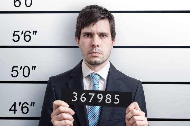 Mugshot of young guilty man at police station. Mugshot of young guilty man at police station. arrest photos stock pictures, royalty-free photos & images