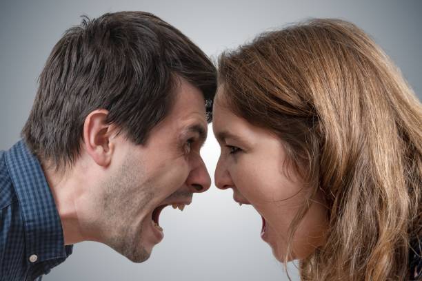 istock Young couple shouting each other. Divorce concept. 1060787646