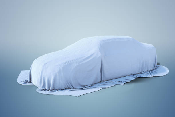 istock New car covered with white cloth. 3D rendered illustration. 1060787792